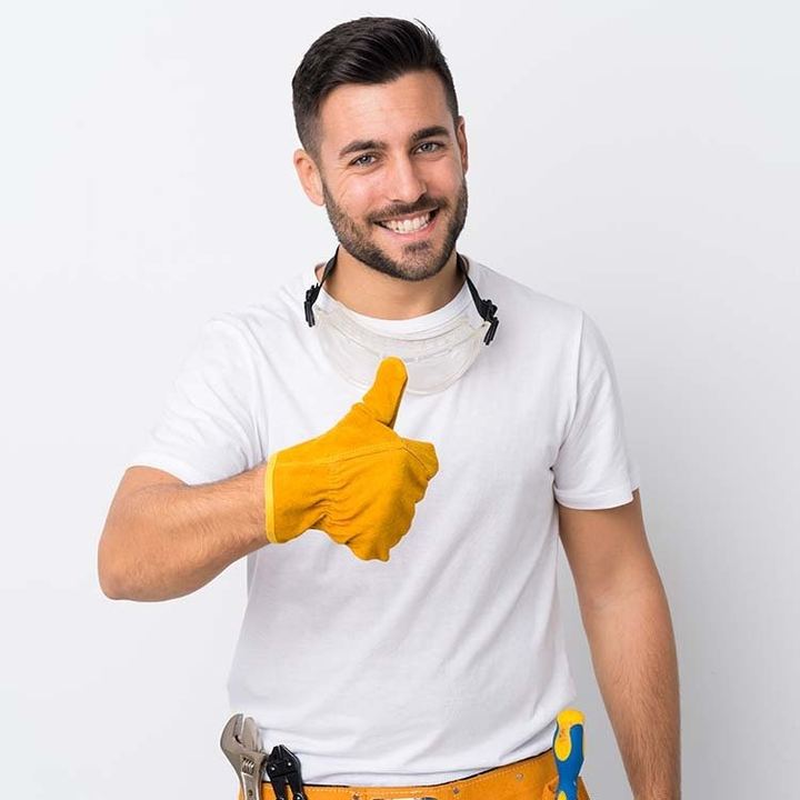 Smiling electrician giving a thumbs up