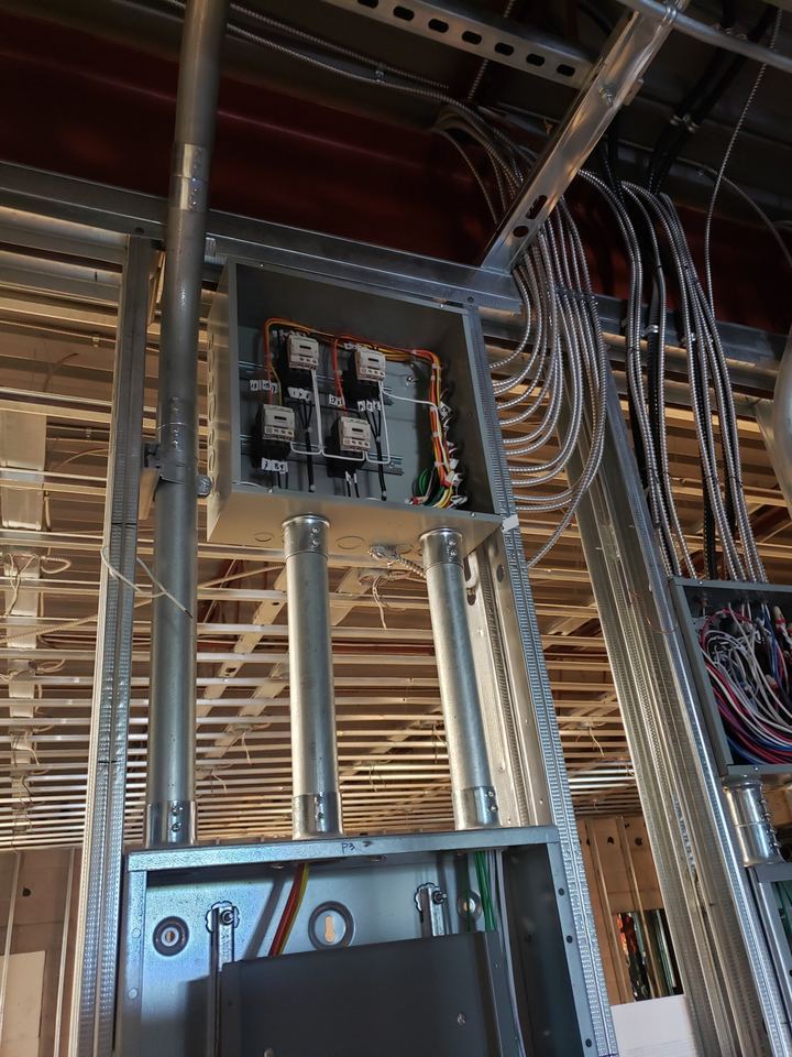 Electrical panel in a framed wall during construction